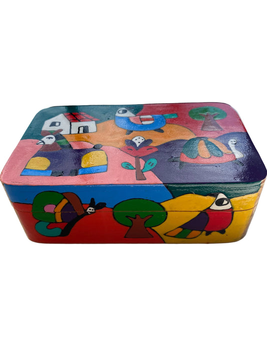 Colorful wooden puzzle with animal designs on a white surface.
